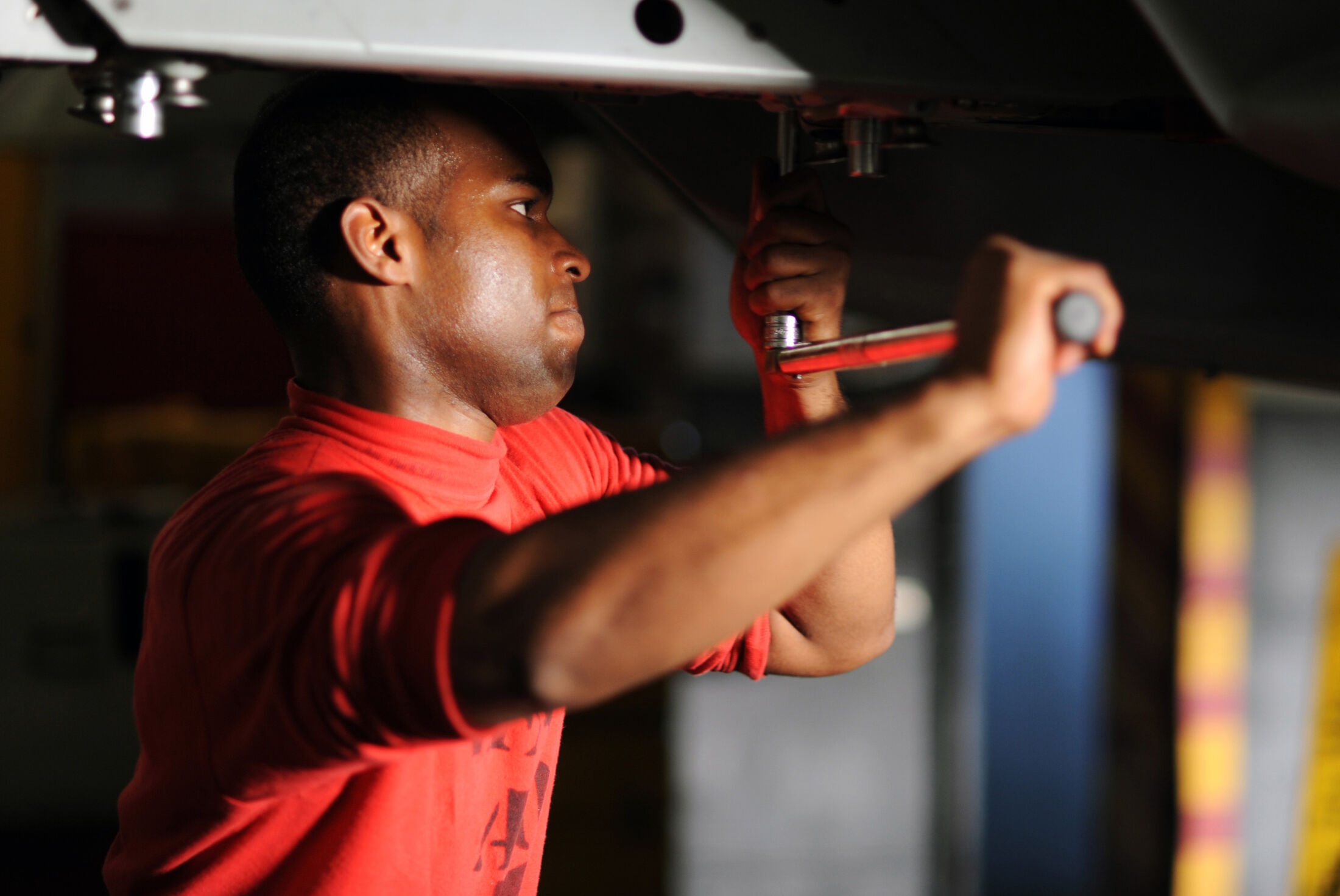 An engineer at work with a spanner